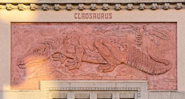 BERLIN, AUGUST 09: A wall surrounding the ZOO in Berlin, GERMANY 2017. Claosaurus in the rays of the setting sun.