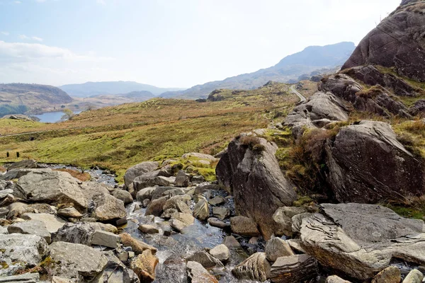 View of the valley from a flowing stream on the Cwmorthin Waterfall trail in the mountains of Snowdonia National Park, Wales. — Stock Photo, Image