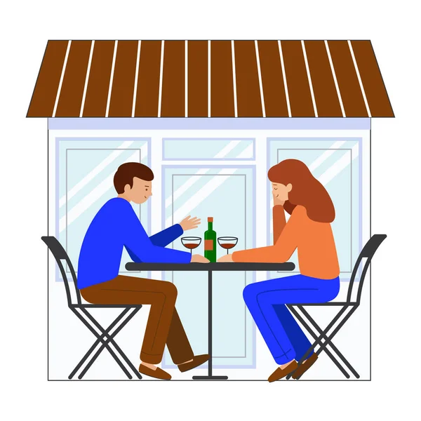 Hombre y mujer sentados en una mesa en un café de la calle. Chico y chica sentados uno frente al otro, en la mesa hay una botella de vino, vasos . — Archivo Imágenes Vectoriales