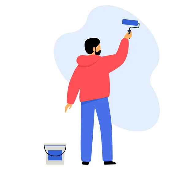 Un hombre pinta una pared con pintura. Trabajador hace una reparación de apartamentos . — Vector de stock