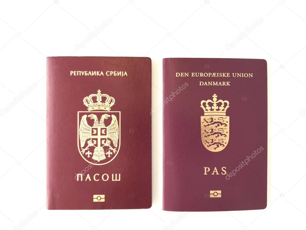 Serbian and Danish Passports on the white background