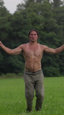 A man tries to jump rope but he cant do it. An athletic man performs jump rope exercises on a scenic outdoor path, showcasing fitness and agility.