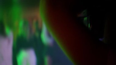 Enjoy captivating moments captured from a lively party, featuring dynamic dance moves and vivid colorful lighting