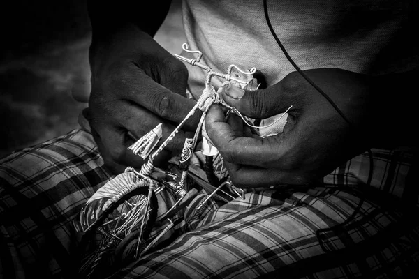 craftsman making a bicycle models with cans in lecce salento italy