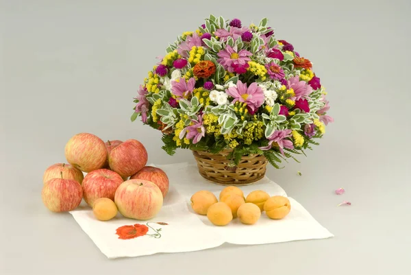 Flowers bouquet and apple still life
