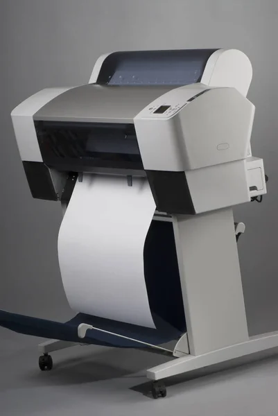 Large format inkjet printer on gray background