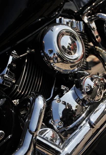 Closed chromed motorcycle engine. Small details in reflection