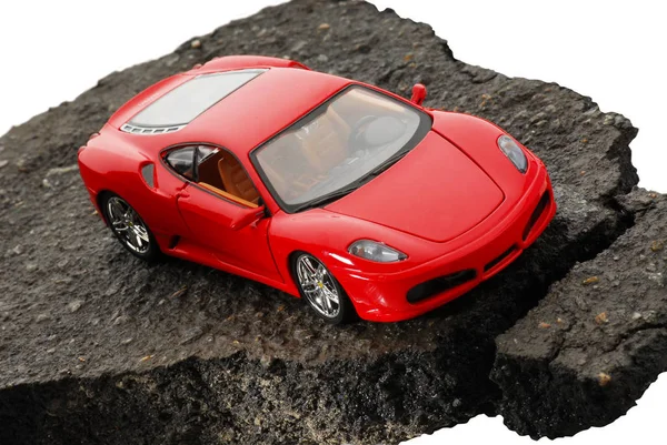 Red, modern, toy, racing machine on asphalt