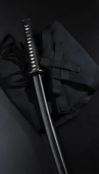 Japanese katana samurai sword. Aikido hakama, martial arts uniform