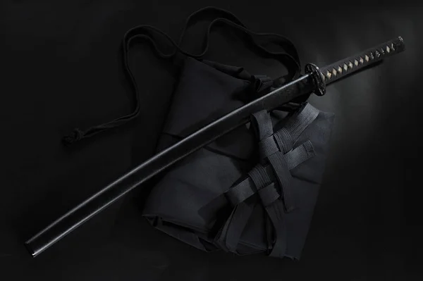 Japanese katana samurai sword. Aikido hakama, martial arts uniform