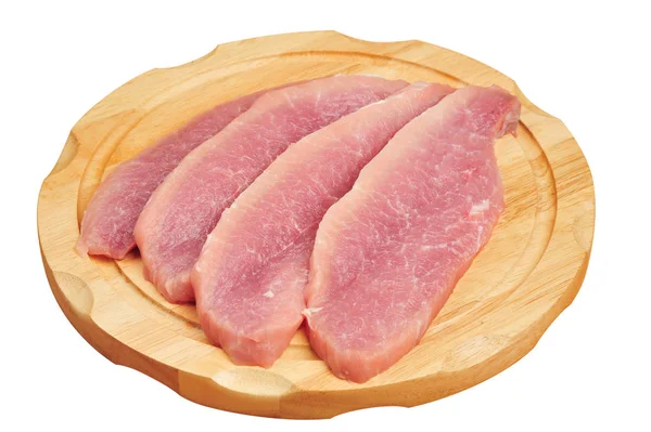 Carne di maiale cruda affettata su una tavola, su uno sfondo bianco isolato — Foto Stock