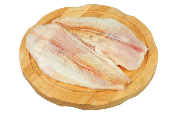 Beyaz izole arka plan üzerinde bir tahta üzerinde Pangasius fileto et