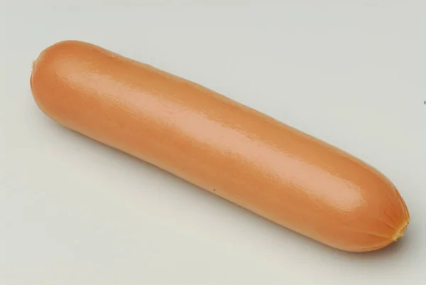 One frankfurter on an isolated gray background — Stock Photo, Image