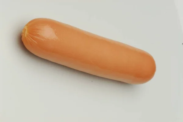 One frankfurter on an isolated gray background — Stock Photo, Image