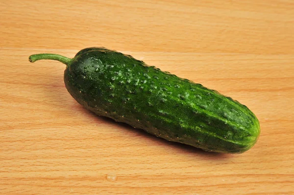 Cucumber isolated on an isolated wooden background — Stock Photo, Image