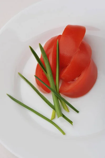 Slices of ripe tomatoes on a plate — Stock Fotó