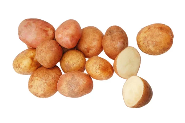 Багато сирої картоплі на білому ізольованому тлі — стокове фото