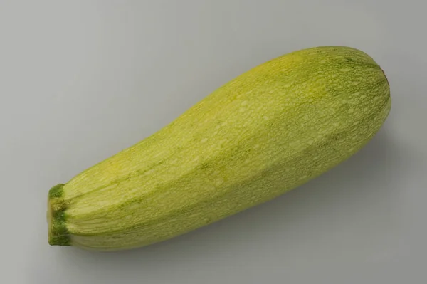 Fresh zucchini isolated on a gray background — Stock Photo, Image