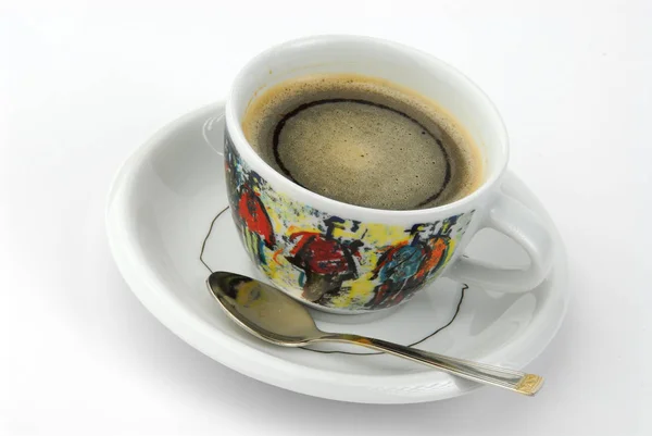 Чашка кофе в цветной чашке на сером фоне — стоковое фото