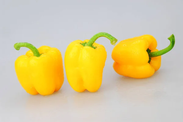 Yellow pepper isolated on a gray background