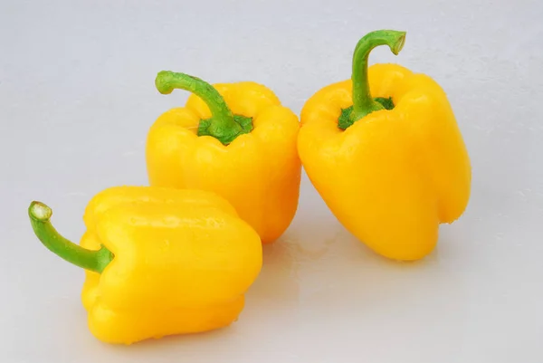 Yellow pepper isolated on a gray background