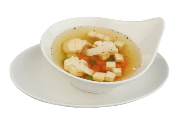 Grönsaks soppa med blomkål, potatis, ärtor, morötter och persilja på vit isolerad bakgrund — Stockfoto