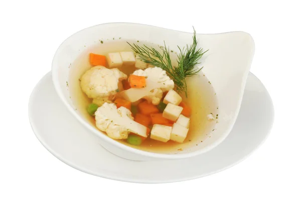 Vegetable soup with cauliflower, potatoes, peas, carrots and dill on a white isolated background — Stock Photo, Image