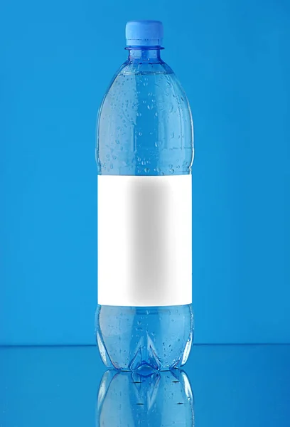 Large plastic bottle of water on a blue background