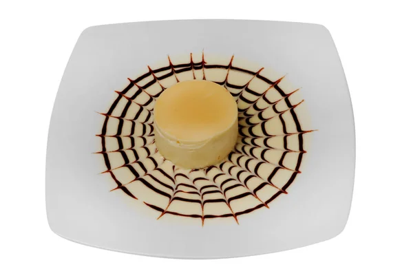 Bit läckra cheesecake på en vit isolerad bakgrund — Stockfoto