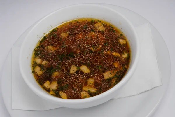 A plate of soup on a gray background — Stock Photo, Image