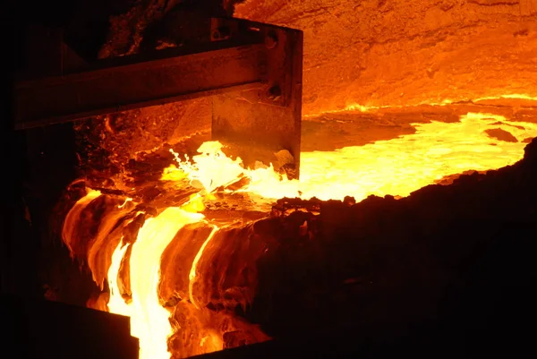 Very rare close view of working open hearth furnace at the metallurgical plant. Molten hot steel