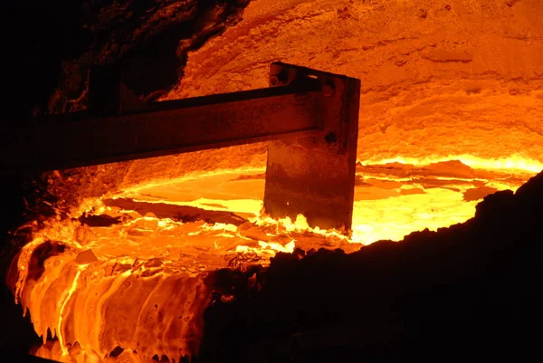 Very rare close view of working open hearth furnace at the metallurgical plant. Molten hot steel