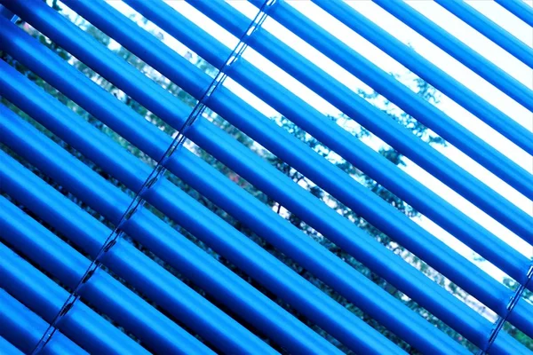 Blinds are effective light protection devices made of vertical or horizontal slats. Slats can be fixed or rotated, regulate light and air flow. Blinds are popular in residential, office and industrial premises.