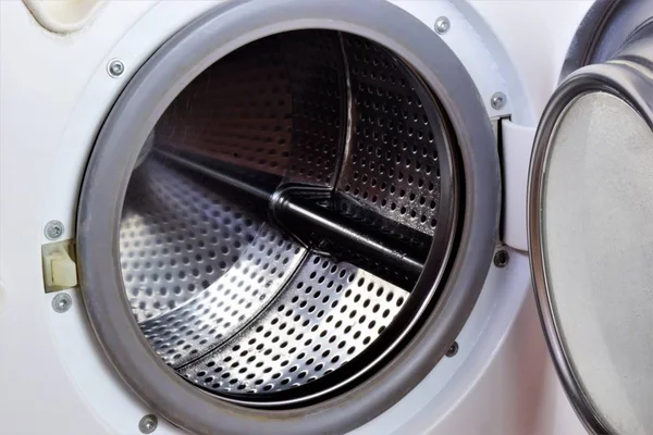 The drum of the washing machine in the Laundry to remove dirt from the clothes. Washing machinea necessary household appliance for washing textiles, underwear and bed linen, bags and other things.