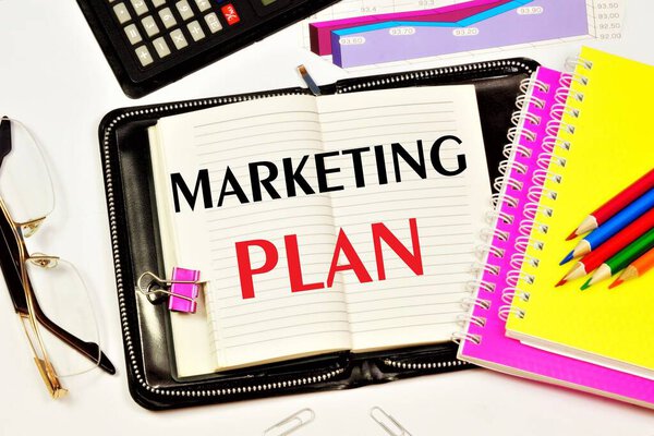 Marketing plan - text inscription in Notepad. A long-term, forward-looking planning approach to achieve a sustainable competitive advantage in promoting a new concept.