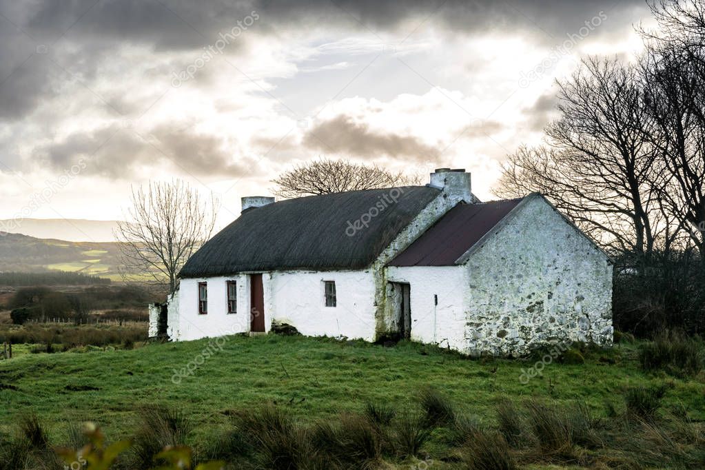 Rural old thatched roof Irish cottage 