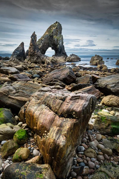 This is the Crohy Head Sea Arch on the west coast of Donegal Ireland.  This picture was taken at low tide on the beach