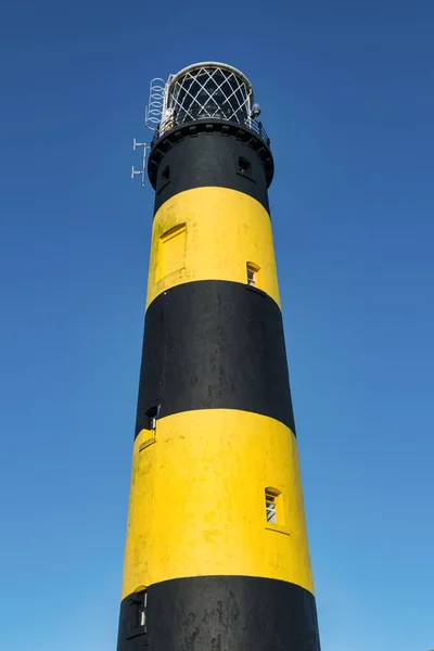 This is a picture of St John\'s Point Lighthouse  on the east coast of Northern Ireland on the Irish Sea.  It is one of Irelands many iconic coastal lighhouses