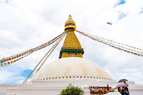 Kathmandu, Nepal - July 15, 2018 : View over Boudhanath ( Boudha ) Stupa, a UNESCO heritage site and an important place of pilgrimage and worship for Buddhists all over the world.