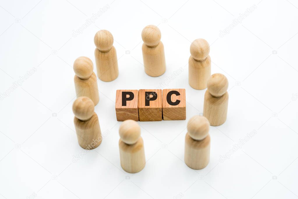 Wooden figures as business team in circle around acronym PPC Pay Per Click, isolated on white background, minimalist concept