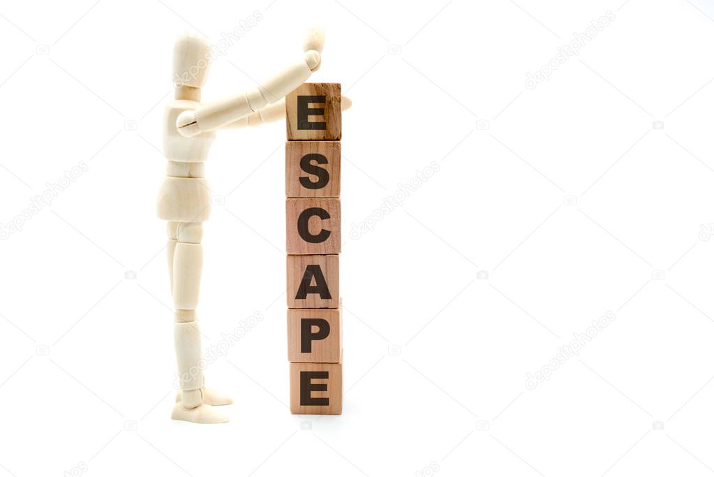 Wooden figure as businessman building Escape as tower of wood cubes, isolated on white background, minimalist concept