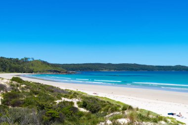 Mağara Beach, Nsw, Avustralya-Aralık 24, 2018: mağara Beach Jervis Bay, sörf ve güneş ışığı, Booderee Milli Parkı, Nsw, Avustralya zevk için bir sessiz kaçış konum güneşli havanın tadını insanlar
