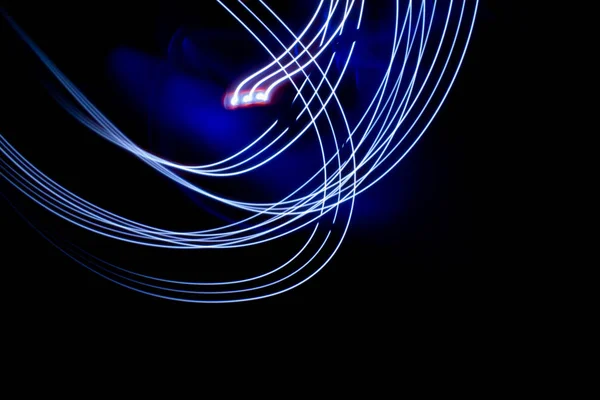 abstract colored lines drawn by light on a black background photography freezelight