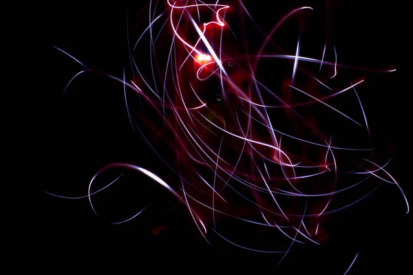 abstract colored lines drawn by light on a black background photography freezelight