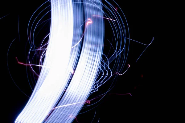 abstract colored lines drawn by light on a black background photography freezelight