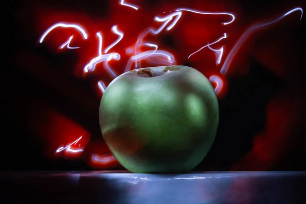 green apple abstract colored lines drawn by light on a black background photography freezelight