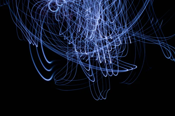 abstract colored lines drawn by light on a black background photography freezelight