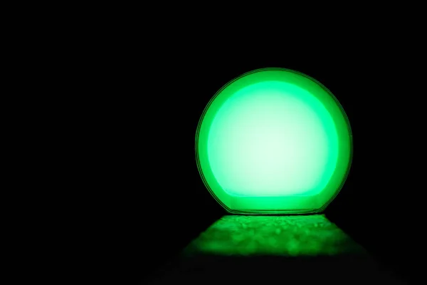 green glow ball and light the path on an isolated black background