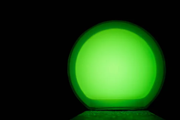 green glow ball and light the path on an isolated black background