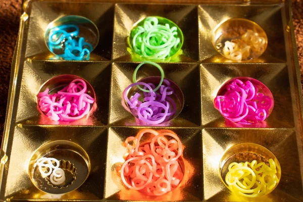 Silicone rubber bands in different colors for braiding bracelets. Child creativity, hobby, handmade.